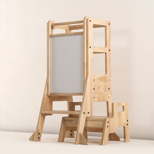 July Forest Montessori tower designed to help toddlers in the kitchen, featuring a built-in chalkboard art easel.