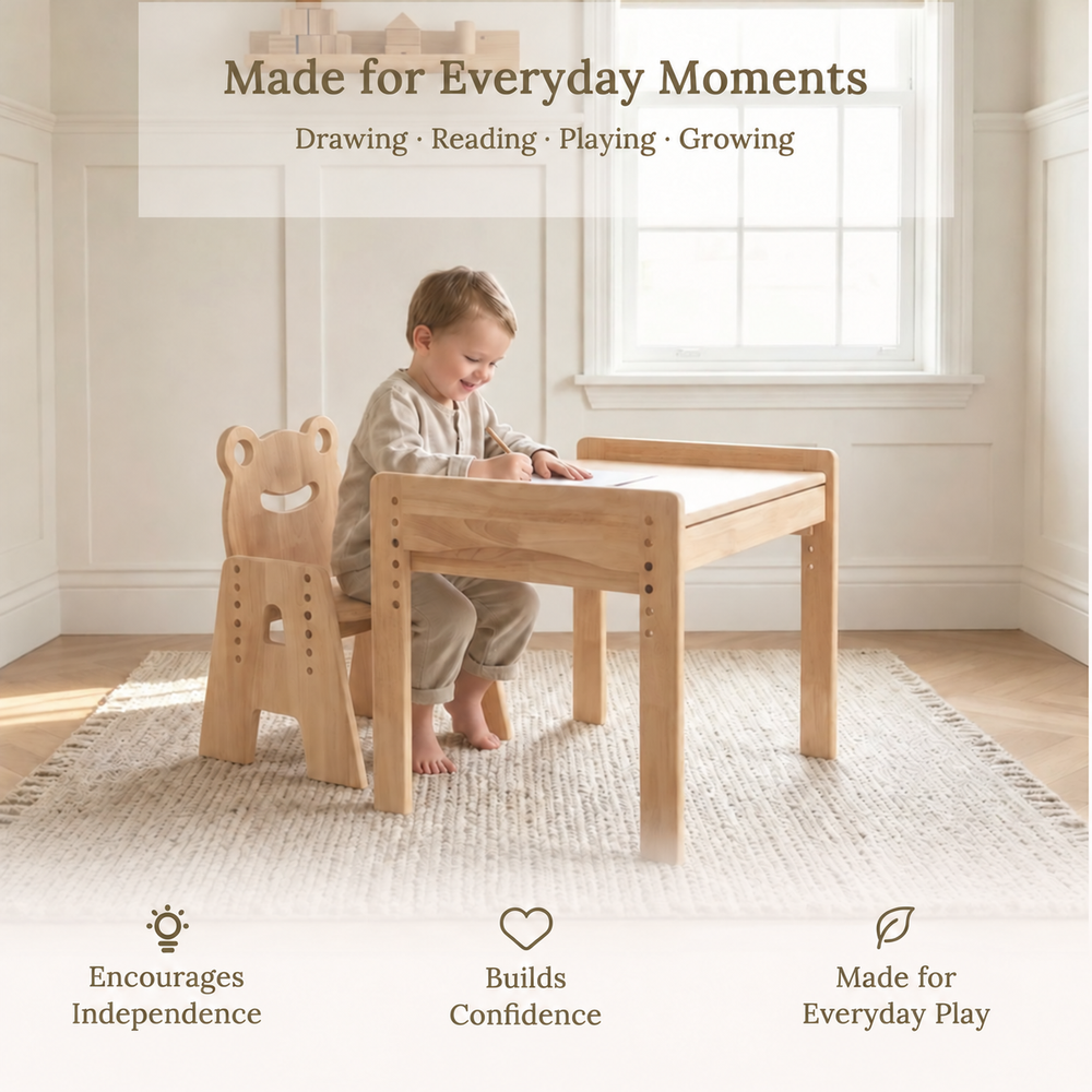 Child drawing at the July Forest adjustable wooden table with a Frog chair in a bright playroom.